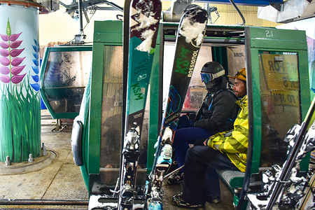 Skiers board a cable car during heavy snowfall in Gulmarg, a world famous ski-resort, about 55kms from Srinagar, the summer capital of Jammu and Kashmir.