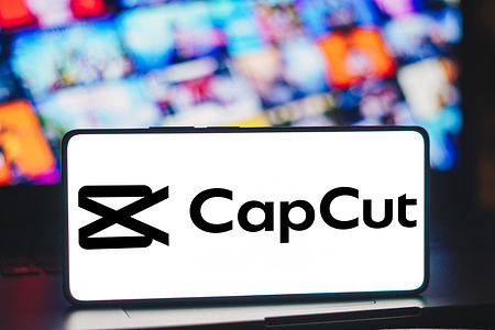 In this photo illustration, the CapCut logo is displayed on a smartphone screen.