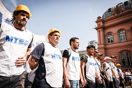 Protesters in their work clothes take part during the demonstration. Workers of the popular economy, organized a protest in front of the National Ministry of Economy against the economic measures of Minister Luis Caputo and President Javier Milei.
