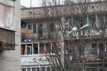 View of a damaged residential building after an alleged drone attack, which was reported by local media at Krasnogvardeisky district. The Russian Ministry of Emergency Situations take security measures around the building.