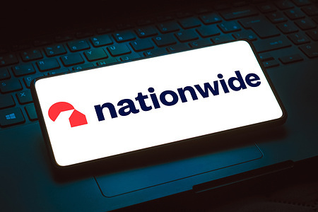 In this photo illustration, the Nationwide Building Society logo is displayed on a smartphone screen.