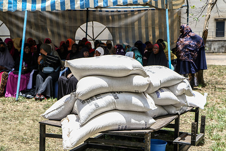 Women follow proceedings during the distribution of food donations to needy members of the Muslim communities by the Government of Kenya ahead of Ramadan in Nakuru. The Government of Kenya donated food to needy Muslim community members before Ramadan.
