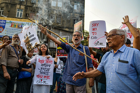 Protesters chant slogans and hold placards expressing their opinion during a demonstration following the central government's notification of the implementation of the Citizenship (Amendment) Act, 2019, in Kolkata.