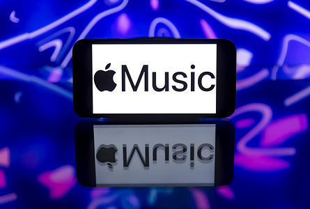 In this photo illustration, an Apple Music logo is seen displayed on a mobile phone screen.