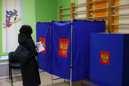 A woman seen entering a voting booth at a polling station as voting begins for the 2024 Russian presidential election. The 2024 Russian presidential election is scheduled to take place from March 15 to March 17. The electorate will have four presidential candidates to consider: Leonid Slutsky of the Liberal Democratic Party of Russia (LDPR), Nikolai Kharitonov of the Communist Party of the Russian Federation, Vladislav Davankov of the New People Party, and the incumbent president, running as an independent, Vladimir Putin.