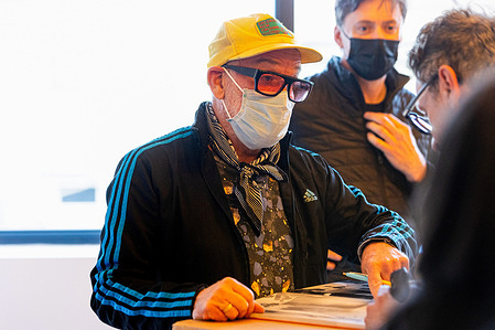 Michael Stipe, former leader of the rock band R.E.M., seen during the signing session at his solo exhibition, titled "I have lost and I have been lost but for now, I'm flying high," presented by Fondazione ICA Milano. Stipe, a multifaceted visual artist and iconic figure in the music world, showcased his art exhibit from December 12, 2023, to March 16, 2024.