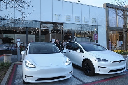 Two Tesla vehicles are seen outside of a Tesla showroom in the neighborhood of Manhasset in Nassau County, Long Island, New York.