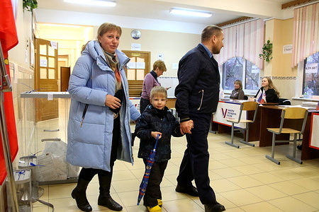 A family visits a polling station to cast their votes during the Russian presidential election. The 2024 Russian presidential election is scheduled to take place from March 15 to March 17. The electorate will have four presidential candidates to consider: Leonid Slutsky of the Liberal Democratic Party of Russia (LDPR), Nikolai Kharitonov of the Communist Party of the Russian Federation, Vladislav Davankov of the New People Party, and the incumbent president, running as an independent, Vladimir Putin.
