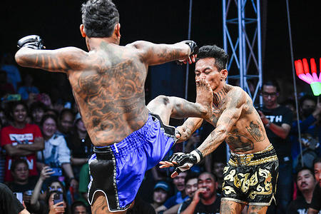 Grandfather Mahamuni (R) and Ajahn Yod fighter of Thailand seen in action at Fight Club Thailand in Navanakorn. Due to the popularity of the movie 'Fight Club' from 1999, Fight Club Thailand began in 2016 and created a community of combat sports enthusiasts through a Facebook group that anounces and organises underground fighting events.