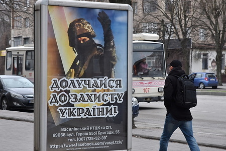 A man walks past the recruitment poster for the Ukrainian armed forces in the center of Zaporizhzhia. When Russia launched its full-scale invasion in 2022, many Ukrainians volunteered to defend their country. But that pool has been exhausted and a large proportion of the men of fighting age are unwilling to be deployed to the front. Only men aged 27 or older have been recruited, with those serving on the battlefield being on average in their 40s. A new mobilisation law — due to be put to a parliamentary vote on March 31 — seeks to update the country’s legal framework ahead of a probable recruitment wave this year in which up to 500,000 people could be drafted.