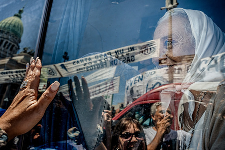Hebe de Bonafini, leader of the Mothers of Plaza de Mayo observes, through the window of a vehicle carrying her during the demonstration of the General Confederation of Labor (CGT) in front of the National Congress in the context of a national strike in rejection of President Javier Milei's measures. The Mothers of Plaza de Mayo is an Argentine human rights organization formed in 1977 by mothers whose children disappeared during the military dictatorship. Their initial purpose was to demand the return of their missing children and seek justice. Today, their mission includes advocating for human rights, social justice, and memory, serving as symbols of resilience and activism globally.