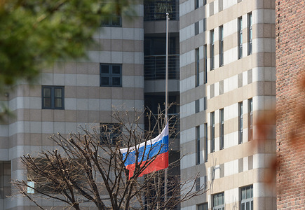 A Russia flag hangs at the Russian embassy, commemorating those killed in the Moscow terrorist attack. Unidentified assailants burst into a concert at the Krokus City Hall in Krasnogorsk, near Moscow on March 22 and sprayed the crowd with gunfire, killing over 60 people, injuring more than 100 and setting fire to the venue. Islamic State claimed responsibility for the attack.