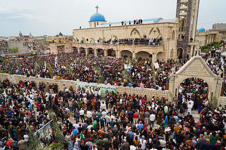 Iraqi Christians participate in the Palm Sunday procession in Al-Hamdaniya District also known Qaraqosh about 35 km southeast of Mosul.
