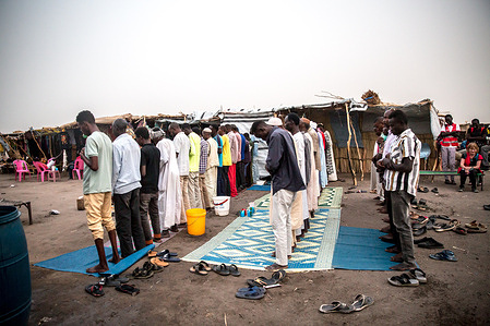 Men pray following iftar, as Ramadan is celebrated by Sudanese refugees and South Sudanese returnees, who have fled the Sudanese war, in a transit centre in Renk, South Sudan. Around 1,000 South Sudanese returnees and Sudanese refugees are crossing the border from Sudan to South Sudan every day. Sudan's war, which began in April 2023, has resulted in the world's largest displacement crisis.