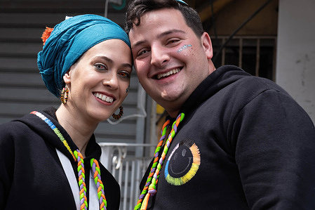 A couple seen wearing colored contact lenses as their costume during the Purim celebration. Ultra-Orthodox Jews Celebrate Purim in Bnei Brak, Israel. The holiday commemorates the salvation of the Jews in ancient Persia from a plot to annihilate them. A joyous holiday, it is celebrated by both secular and nonsecular Jews, most notably by dressing up in costumes and drinking, according to the Talmud, “until they cannot distinguish between ‘cursed is Haman’ and ‘blessed is Mordechai."