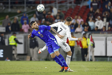 Argentina's Cristian Romero (L) and Costa Rica's Anthony Contreras (R) in action during an international friendly soccer match at Los Angeles Memorial Coliseum. Final score; Argentina 3:1 Costa Rica