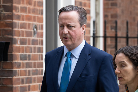 Lord David Cameron is seen leaving a cabinet meeting in Downing Street, London.