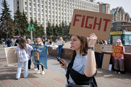 A protester holds a placard calling for authorities to return their relatives from Russian captivity during a rally in central Kyiv. Relatives of defenders of the Azovstal metallurgical plant staged a rally demanding the Ukrainian authorities to free and return their relatives from Russian captivity. Russian troops entered Ukrainian territory in February 2022, starting conflicts that provoked destruction and a humanitarian crisis.