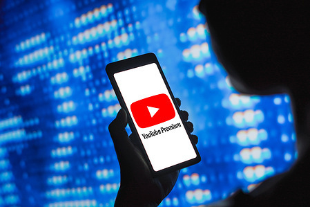 In this photo illustration, the YouTube Premium logo is displayed on a smartphone screen.