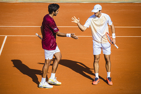 Francisco Cabral (L) and Nuno Borges (R) from Portugal in action during the doubles match against Sadio Doumbia and Fabien Reboul from France (not pictured) for the round of 16 of the Millennium Estoril Open ATP 250 2024 tennis tournament at Clube de Tenis do Estoril. Sadio and Fabien win against Francisco and Nuno 7-6, 3-6, 10-7