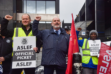 Mick Whelan (C), General Secretary of ASLEF (Associated Society of Locomotive Engineers and Firemen) union, joins the picket outside Euston Station as train drivers stage a fresh round of strikes over pay.