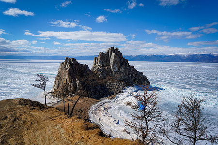 View of the Shamanka Rock located on Lake Baikal in Siberia. The Shamanka Rock is known as a natural temple for practitioners of shamanism and Buddhism. The meter-thick blue ice covering frozen Lake Baikal has transformed into a popular winter tourist destination over the years. Typically, visitors flock to Olkhon Island, the third-largest lake island globally, to marvel at the world's deepest lake. However, due to the prolonged Russian-Ukrainian conflict and ensuing international sanctions since 2022, the number of visitors to the island has significantly declined, with a majority of tourists hailing from China.