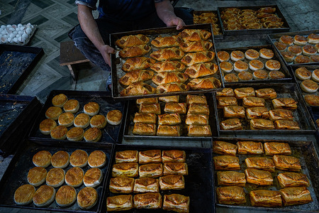 A worker assembles bakery items at a factory ahead of the Muslim festival Eid al-Fitr, which marks the end of the holy month of Ramadan in Srinagar.