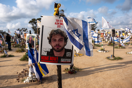 A poster of Alon Ohel, taken hostage seen at the memorial Nova music festival with his age of "22" been crossed out and updated to "23" years. On October 7th, 2023 the Palestinian Islamist militant group Hamas led a surprise attack on Israel, killing an estimated 1200 Israelis and taking more than 200 hostages. An estimated 360 young men and woman who attended the Nova music festival were killed during the attacks. The site of the festival has now become a memorial site to those who were killed and taken as hostages.