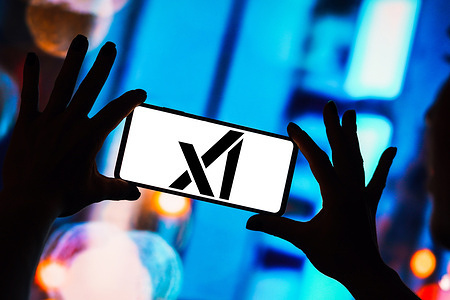 In this photo illustration, the xAI logo is displayed on a smartphone screen.
