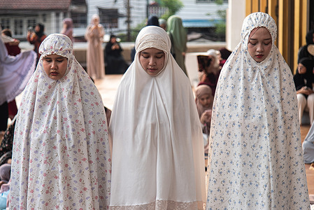 Muslims perform Eid al-Fitr prayers at the Islamic center of Thailand. Eid al-Fitr is a religious holiday celebrated by Muslims around the world that marks the end of Ramadan, Islamic holy month of fasting.
