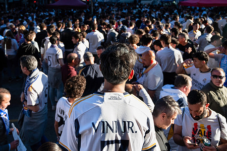 A Real Madrid fan wearing a Vinicius Jr jersey as supporters attend the Champions League football match against the British football team Manchester City at the Santiago Bernabéu stadium.
