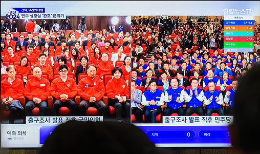 South Korea's 24-hour Yonhapnews TV shows ruling People Power Party’s leader Han Dong-hoon(L of C) with party members watching results of exit polls for the parliamentary election at the National Assembly and main opposition Democratic Party leader Lee Jae-myung(R of C) with party members at Yongsan Railroad Station in Seoul. South Korea's opposition bloc, including the main opposition Democratic Party, was expected to sweep more than 200 seats in a parliamentary election on April 10, a crushing defeat for the ruling People's Power Party and the president of Yoon Suk Yeol, exit polls showed.