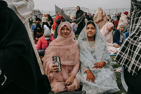 Thousands of Muslim worshippers gather for an Eid Al-Fitr prayer in Bay Ridge, Brooklyn. Community leaders encouraged community members to be mindful of war and starvation in the predominantly Muslim regions of Gaza, Yemen, and Sudan, and tone down the normally lavish celebrations that mark the end of Ramadan fast.