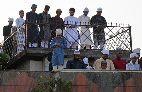 Muslim men pray on the roof of a mosque on the occasion of Eid al-Fitr in Mumbai. Eid al-Fitr marks the end of holy fasting month of Ramadan for the Muslims.