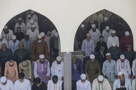 Muslims offer Eid al-Fitr prayers marking the end of the holy fasting month of Ramadan at National Eidgah in Dhaka. Eid al-Fitr is a religious holiday celebrated by Muslims around the world that marks the end of Ramadan, Islamic holy month of fasting.