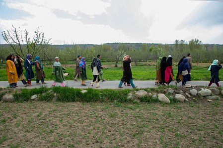 Kashmiri residents walk towards the gun battle site after operation ended at Frasipora area of Pulwama district, south of Srinagar. Indian police officials claimed to have killed a local militant Danish Aijaz Sheikh, a resident of Srinagar, who recently joined the militant outfit two weeks ago. This encounter occurred after a gap of three months, police officials told the local media.