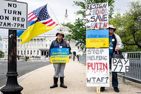 Protesters hold placards during the demonstration for aid to Ukraine through the passage by Congress of the National Security Supplemental, at the U.S. Capitol.