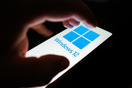 In this photo illustration, the Windows 12 logo is displayed on a smartphone screen.