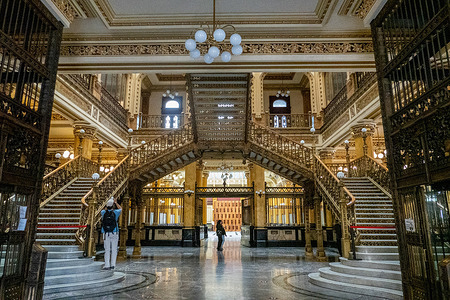 Visitors explore the architectural wonders of the historic post office in Mexico City, known as the Palacio de Correos.