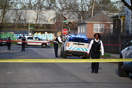 Police look for evidence at the crime scene where a 20-year-old male was fatally shot in Chicago. At approximately 5:19 p.m. Saturday in the 7700 block of S. Union, a 20-year-old male victim was standing on the sidewalk when two unknown male suspects fired multiple gunshots in the victim’s direction from down the street. The victim sustained one gunshot wound to the lower back, the suspects fled on foot and got into a Silver vehicle before fleeing the scene. The victim was transported to The University of Chicago Hospital and was pronounced dead at the hospital. There are no suspects in custody.