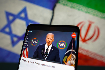 In this photo illustration, a live broadcast of Joe Biden, the President of the United States, speaking about the war between Israel and Iran on a smartphone screen.