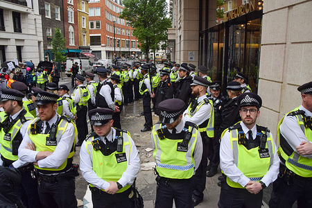 Police officers form a cordon after pushing away protesters blocking the entrance during the demonstration. Pro-Palestine protesters blocked the offices of London Metric, calling on the property company to evict weapons and parts manufacturers Elbit Systems, BAE and Boeing, whom the protesters say are "complicit" in Israel's attacks on Palestinians in Gaza.