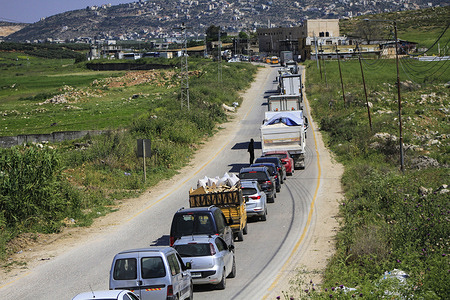A queue of Palestinian vehicles wait at the Beit Furik checkpoint east of the city of Nablus after it was closed by the Israeli army.