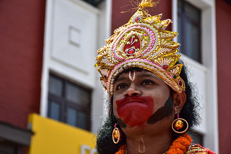 A devotee dresses as a Hindu deity during aa religious procession to celebrate the festival of Ram Navami in Srinagar. The festival of Ramnavami marks the birth of Lord Ram, and marks the day with various rituals. Hindus celebrate the occasion according to either the time the lunar calendar shifts into the ninth day, or when the sun rises on the ninth day.