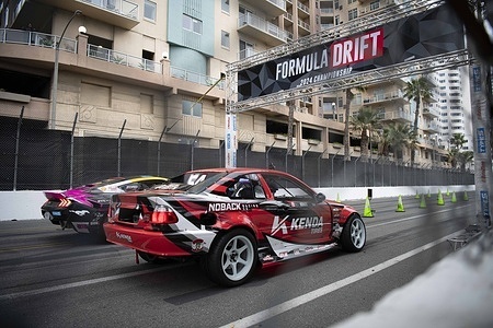 Nick Noback (right) and Ben Hobson (left) line up before the start of their seeding battle. Formula Drift is back for another year of competition, starting their first round on the streets of downtown Long Beach. With this years' newly implemented seeding brackets, drivers were able battle their way to the top instead of the single qualifying laps done in years prior. This gave the fans a better viewing experience of the event and allowed drivers to truly test their skills among fierce competition. After a cold and wet weekend full of numerous hardships including a devastating engine fire, James Deane was able to secure the top spot for round one and take the lead into the next round of competition.