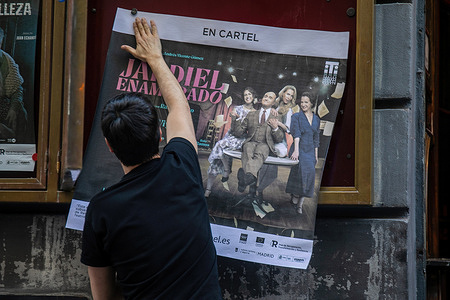 An operator at the Infanta Isabel theater in Madrid removes the poster for the play 'Jardiel in love'. The play "Jardiel in Love," which was being presented at the Infanta Isabel Theater in Madrid, has been canceled after the Madrid Provincial Prosecutor's Office filed a complaint this week against the director Ramón Paso for alleged sexual crimes committed against several women between 2018 and 2023.