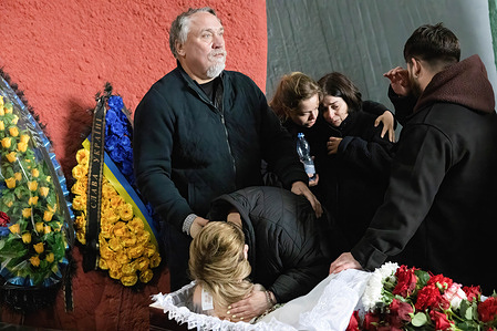 (EDITORS NOTE: Image depicts death)
Relatives mourn near the coffin with the body during the funeral ceremony for the Ukrainian writer Dmytro Kapranov at the Baikovo cemetery in Kyiv. Ukrainian writer and public figure Dmytro Kapranov died of heart disease on April 16, 2024.