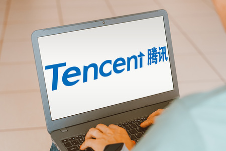 In this photo illustration, the Tencent logo is seen displayed on a laptop screen.