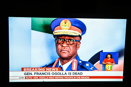 A photo of a TV screen showing the news of Kenya's TV47 announcing the death of Chief of Defense Forces, General Francis Ogolla, who lost his life along with nine others in a military helicopter crash shortly after take-off in Elgeiyo Marakwet, located approximately 400km northwest of Nairobi. His body has been transported to Nairobi Embakasi Garrison. President William Ruto has declared three days of national mourning following the accident, during which flags will be flown at half-mast.