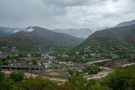General view of residential houses on the foothills of mountain in Banihal, an area in Ramban district. The Himalayan region of Kashmir witnessed rains from the past several days that halted the traffic movement and disrupted normal life.
